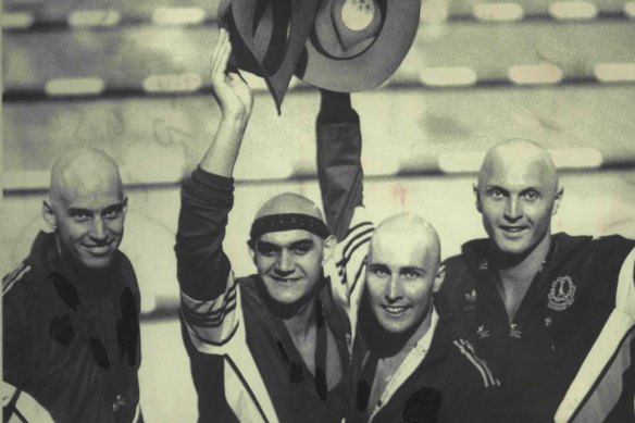 Australia's “Mean Machine” pose with their gold medals after they won the final of the mens 4x100 freestyle relay. 