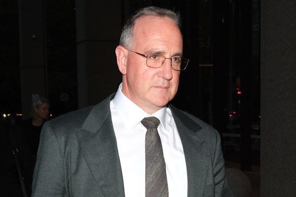 Woolworths’ former chief commercial officer Paul Harker leaves the Federal Court in Sydney.