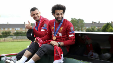 Dejan Lovren (left) and Mohamed Salah prepare for the parade.