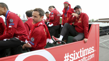 Liverpool manager Jurgen Klopp takes it all in on the back of the open-air bus parade through the city.