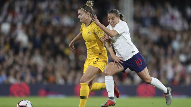 England's Fran Kirby, right, battles Australia's Steph Catley.