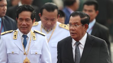 Cambodian Prime Minister Hun Sen, right, says his government has defeated an attempt at a coup.