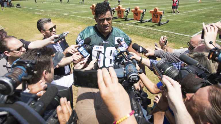 Centre of attention: Jordan Mailata is tackled by a media scrum after making the Eagles' final roster.