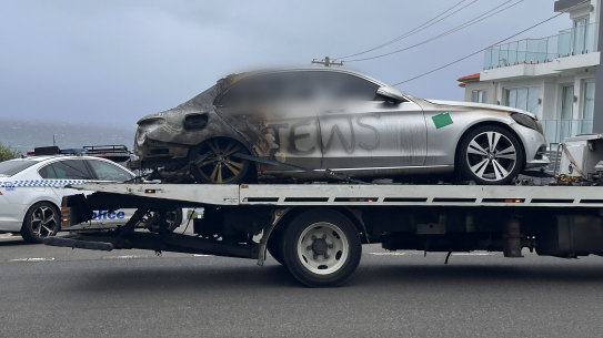 One of the burnt out cars sprayed with antisemitic graffiti in Sydney.