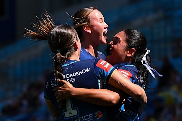 The Titans celebrate a try.