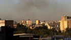 Smoke rises from the area around the International Airport following an airstrike, as seen from Sanaa.