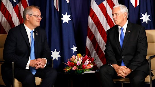 Australian Prime Minster Scott Morrison, left, and U.S. Vice President Mike Pence shake hands during a bilateral meeting on the sidelines of the APEC Summit in Port Moresby, Papua New Guinea, Saturday, Nov. 17, 2018. (AP Photo/Mark Schiefelbein, Pool)