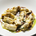 Agnolotti filled with Moreton Bay bug meat and served with a lobster bisque and butter sauce at Little Black Pig & Sons.