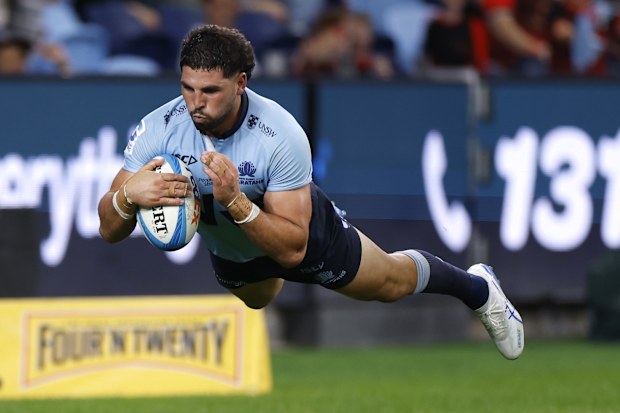 Triston Reilly of the Waratahs scores a try.