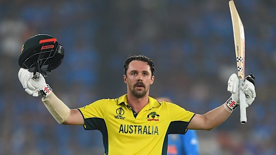 Travis Head celebrates his century in the World Cup final.