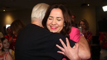 Annastacia Palaszczuk shares a hug with her father, former Labor minister Henry Palaszczuk, after winning her third term as Queensland premier.