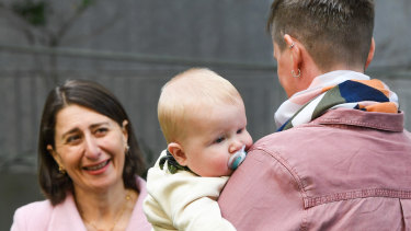 Premier Gladys Berejiklian and new mum Genevieve Whitlam and six-month-old son Arlo.