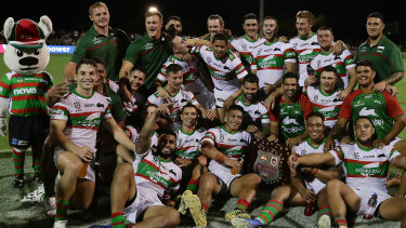 Rabbitohs players celebrate with the Charity Shield in Mudgee.