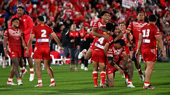 Tonga celebrate Saturday’s win over New Zealand.