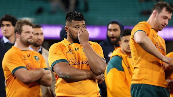 Folau Fainga’a and teammates look on after a Wallabies defeat.