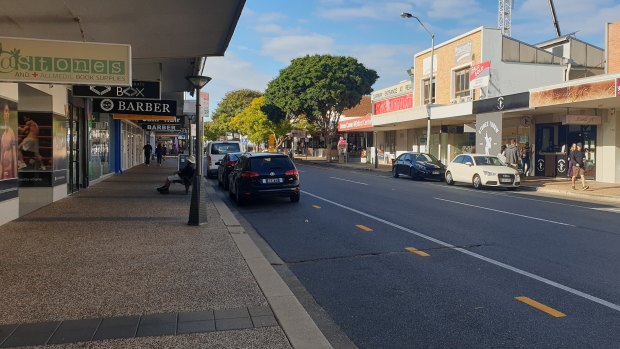 Brisbane's Stones Corner, a high street in the suburb of Coorparoo, during the global pandemic. Foot traffic has dropped and many "For lease" signs are up.