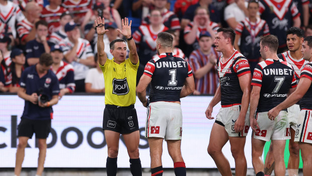 Referee Gerard Sutton sends Roosters centre Joey Manu to the sin-bin in round three.