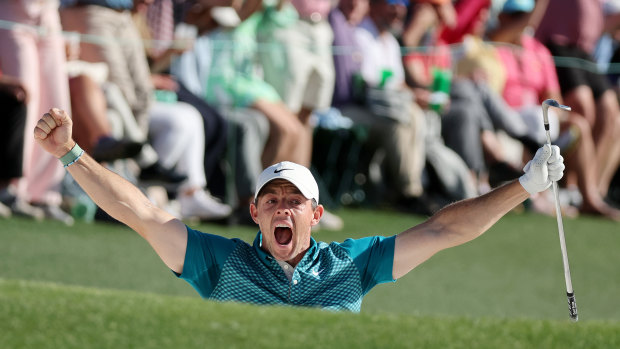 Rory McIlroy celebrates chipping in on the final hole.