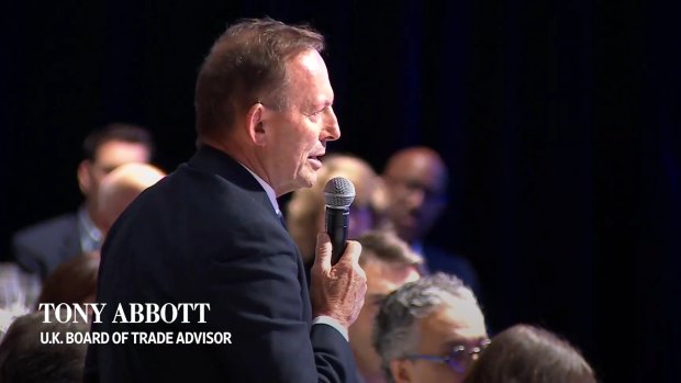 Former prime minister Tony Abbott confronts US House Speaker Mike Johnson from the audience of the WSJ CEO Council event in Washington. 