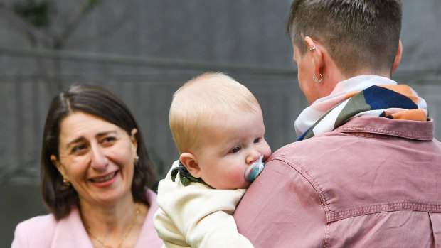 Premier Gladys Berejiklian and new mum Genevieve Whitlam and six-month-old son Arlo.
