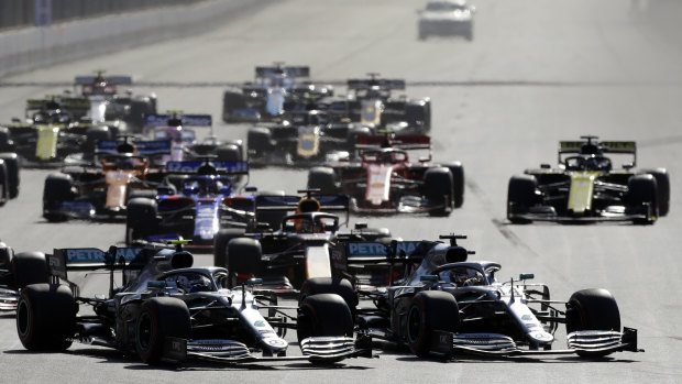 Pace setters: Brit Lewis Hamilton, right and Flying Finn Valtteri Bottas, left, lead the field into the first turn.