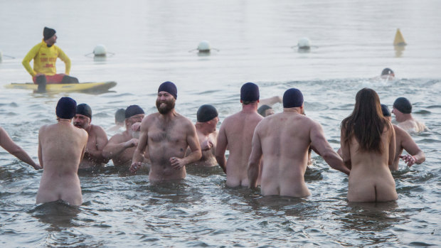 Nude swimmers brave a -3 degree morning for a charity dip in Lake Burley Griffin.