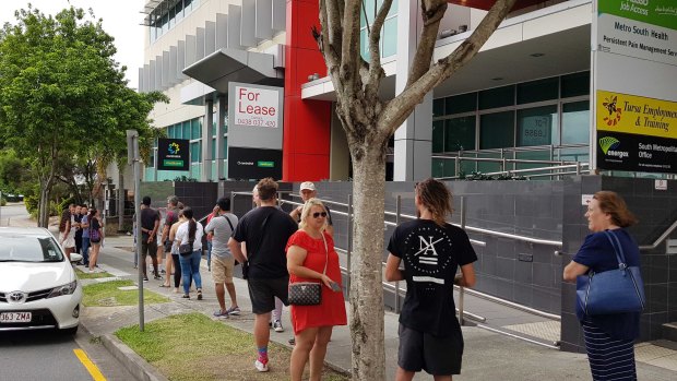 A queue outside the Mount Gravatt Centrelink office in Brisbane the day after major job cuts were announced across the state in March.