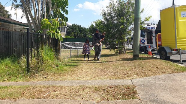 A mother who drove to the area with her children to leave flowers.