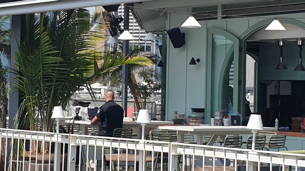 Police investigate a fire at Mr Percival's bar at Howard Smith Wharves in Brisbane.