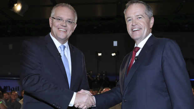 It's the economy ... Australian Prime Minister Scott Morrison, left, and Opposition Leader Bill Shorten shake hands before the second leaders' debate on Friday.