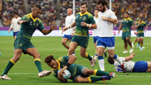 Will Genia crosses for Australia's fifth try against the South Americans.