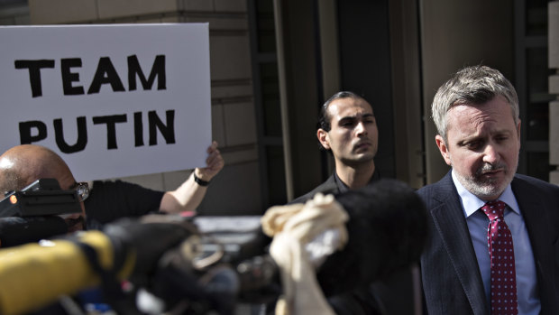 Jeremy Lessem, lawyer for Richard Pinedo of Santa Paula, California, centre, speaks to members of the media as Pinedo, centre left, listens outside federal court after sentencing in Washington, DC.