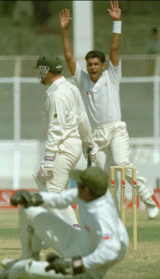 Waqar Younus celebrates as Mark Taylor makes a pair. Friday, Sept. 30, 1994 at the National Stadium in Karachi.