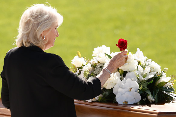Maree Selwood, mum of Troy, places a rose for her son.
