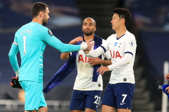 Hugo Lloris of Tottenham Hotspur confronts teammate Heung-Min Son.