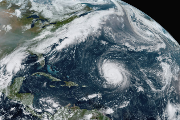 Hurricane Teddy in the Atlantic, centre; tropical depression 22 (Alpha) in the Gulf of Mexico, left; the remnants Paulette, top right; and Wilfred, lower right. 