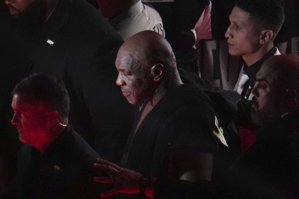 Mike Tyson makes his exit. To count his money, presumably. 