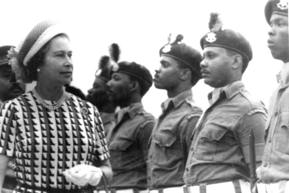 Queen Elizabeth inspects a guard of honour in Bridgetown, Barbados in 1977. She will cease to be Barbados’ head of state on November 30.