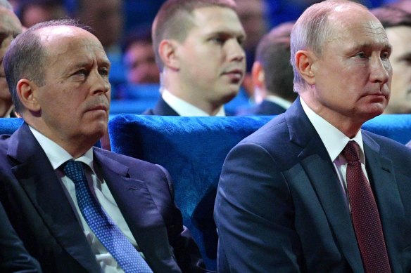 FSB director Alexander Bortnikov, left, with President Vladimir Putin in  December 2019.