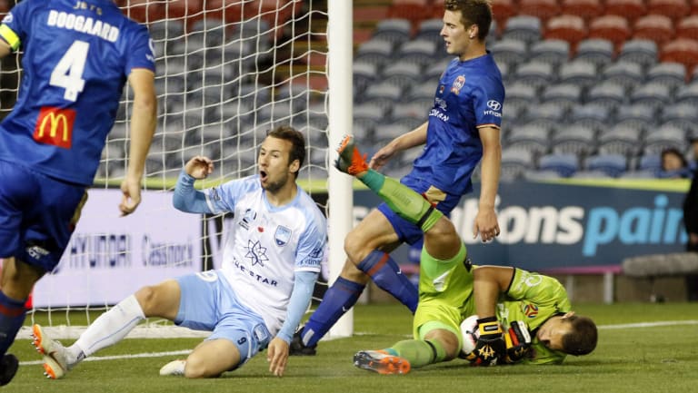 Keeping custody: Glen Moss cleans up the ball for the Jets before Adam Le Fondre arrives.