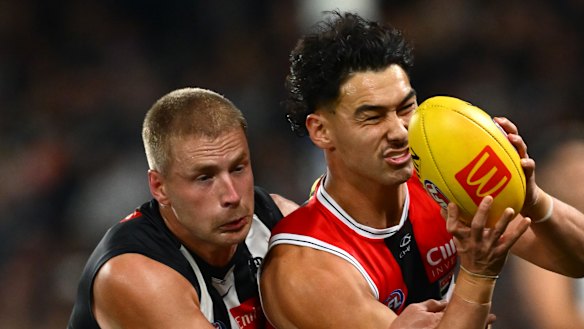 Mitch Owens of the Saints marks the ball in front of Billy Frampton of the Magpies.