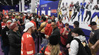 NFL fans shop at the Super Bowl. Rising wages have offset a cost of living crisis in the United States.