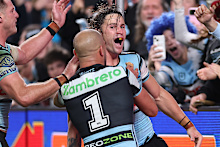 Nicho Hynes celebrates a try.