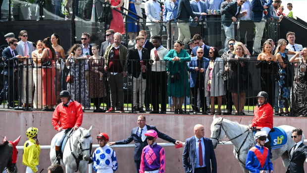 Bravado, fashion and protesters on show at the Caulfield Cup