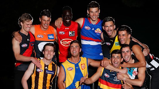 First round draftees, including Mac Andrew (third from left, top row), pose for a photo on Wednesday night.