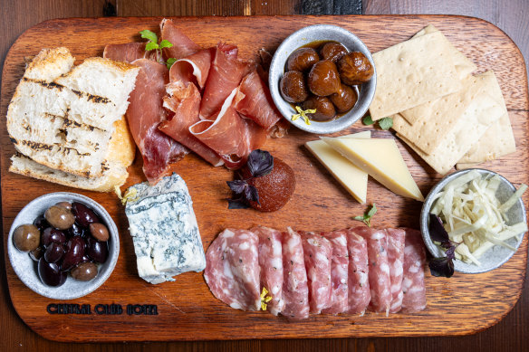 Grazing board with salami, jamon, comte and gorgonzola, with the board made from the original keg chutes.