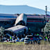 Emergency services attend to the victims at the scene of a collision between two trains in Urda, Spain.