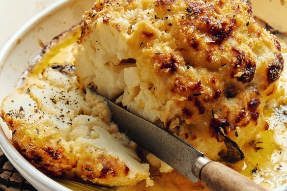 Whole baked cauliflower with comte and parmigiano cheese sauce.