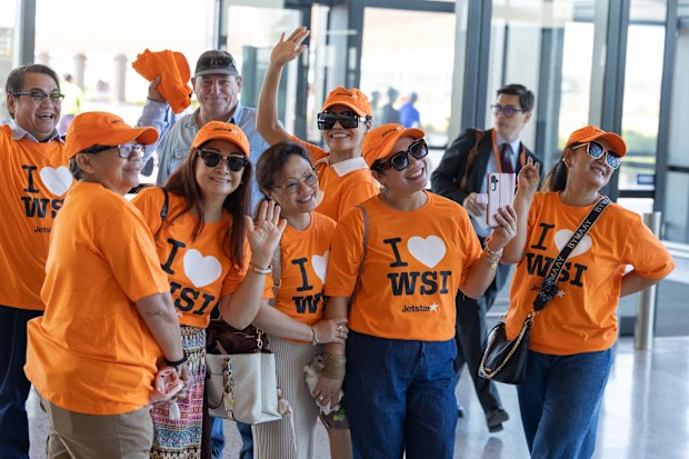 Passengers and crew gear up for the historic Jetstar take off at WSI Airport.