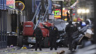 Emergency personnel work the scene on Bourbon Street after a vehicle drove into a crowd.